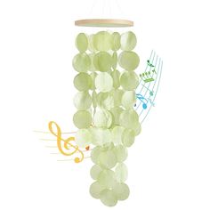 a mobile made out of green beads and musical notes hanging from it's side