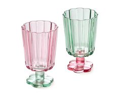 two glass vases sitting next to each other on a white surface, one pink and one green