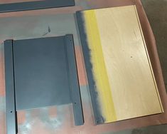 several different types of wood and metal on a table with paint applied to the sides