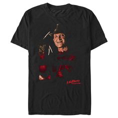 a t - shirt with the image of a man holding a baseball bat and wearing a hat