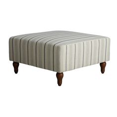 a striped footstool with wooden legs on an isolated white background for use in furniture design