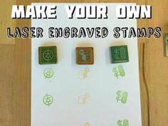 three rubber stamps with the words make your own laser engraved stamps on them, sitting on top of a piece of paper