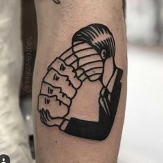 a man's arm with a black and white drawing of a woman on it