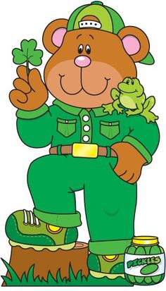 a teddy bear dressed in green holding a frog