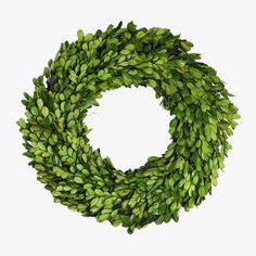 a wreath with green leaves is shown against a white background and looks like it could be used as an ornament