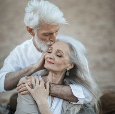 an older couple is embracing each other