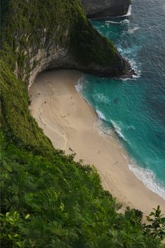 an aerial view of the beach and cliffs near nusa penida island, bali