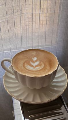 a coffee cup sitting on top of a saucer