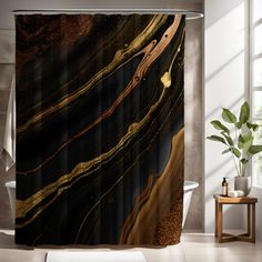 a bathroom with a black and gold shower curtain