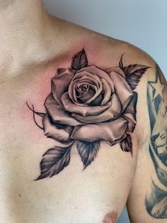 a man with a rose tattoo on his chest