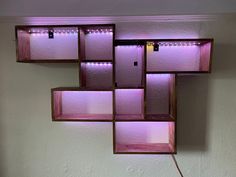 a room with some shelves and lights on the wall