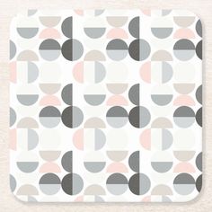 an abstract geometric pattern in grey, pink and white beverage coasters