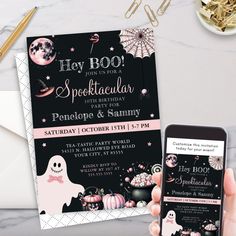 a person holding up a phone next to a halloween party card