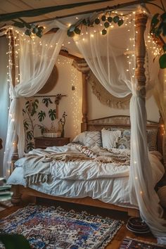 a canopy bed with white curtains and fairy lights on the headboard is surrounded by greenery