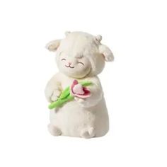 a white stuffed animal holding a pink flower