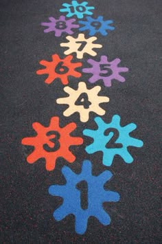 colorful numbers are painted on the asphalt to make them look like snowflakes