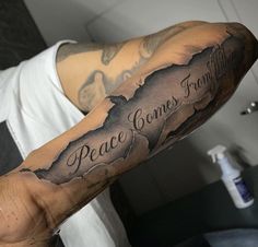 a man with a tattoo on his arm that says, peace comes from within