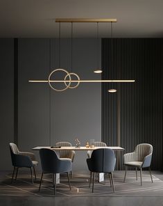 an elegant dining room with grey walls and chairs around a round table surrounded by hanging lights