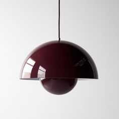 a dark colored lamp hanging from a ceiling