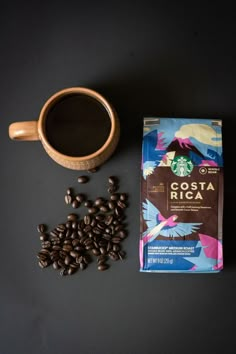 coffee and beans on a table next to a bag of costa rica roasting powder