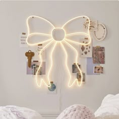 a white bed topped with lots of pictures and lights