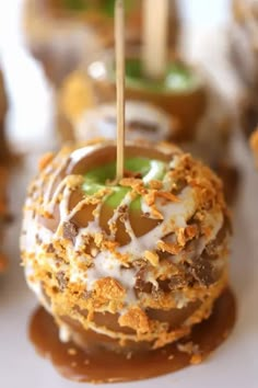 chocolate covered donuts with white icing and sprinkles