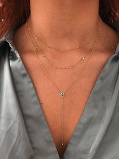 Add a touch of drama to your necklace story. 1 pear Emerald, 0.21ct, lies at the heart of the piece, surrounded by a Diamond halo and finished with a single round bezeled Diamond at the end of the lariat. (0.07tcw Diamonds, SI clarity, G-H color). Beautiful for V-necklines, this piece can be dressed up for your most special occasions or dressed down for everyday elevation. Adjustable length: 18-20'' Please note that no two stones are alike, therefore slight stone variations might be present. Diy Jewelry Necklace, Single Stone, Fine Jewelry Collection, Diamond Halo, Emerald Diamond, Layered Look, Jewelry Necklace, Minimalist Jewelry, Halo Diamond