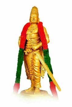 a golden statue with a green and red scarf on it's head, standing in front of a white background