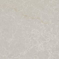 a white marble textured surface with gold veining