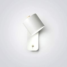 a white wall light with a metal base and a small bulb on the top of it