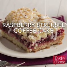 raspberry streusel coffee cake on a white plate with the words taste of home