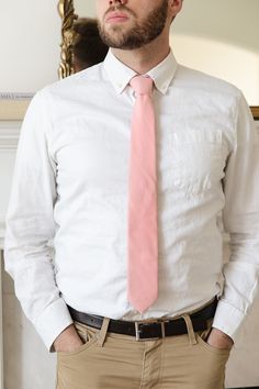 Elevate your man's professional attire with the Max Mens Tie in Spring Pink. Featuring a classic Easter pink, this self-tie style allows for a comfortable fit every time. Stay stylish and polished with this versatile accessory. Perfect for matching the fam! Classic Spring Suit And Tie Accessories For Semi-formal, Semi-formal Ties For Spring, Classic Suit And Tie Accessories For Spring Workwear, Classic Tie For Semi-formal Spring Occasions, Classic Semi-formal Ties For Spring, Classic Ties For Semi-formal Spring Occasions, Classic Suit And Tie Accessories With Adjustable Ties, Classic Fitted Suit And Tie Accessories With Adjustable Ties, Classic Business Suit And Tie Accessories With Adjustable Ties