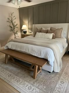 a bedroom with a large bed and wooden furniture