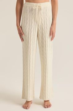 Indulge in the plush comfort of these high-rise cable knit pants, crafted from our luxurious Marshmallow Yarn. The full-length design and elastic waistband make them perfect for cozying up in style all season long.Straight legMarshmallow Yarn: 100% PolyesterMachine Wash Cold, Gentle cycle, Tumble Dry Low or Hang to Dry