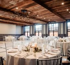 an empty banquet room with tables and chairs