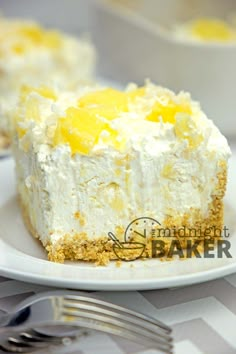 a piece of cake on a white plate with silverware next to it and a fork