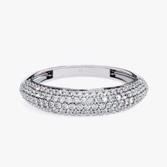 a white gold ring with rows of round brilliant cut diamonds set in the center and sides