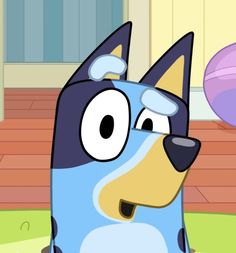 a cartoon dog is standing in front of a ball