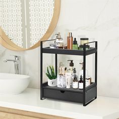 a bathroom with a sink, mirror and shelves on the counter top in front of it