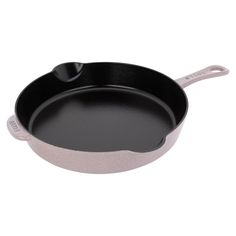 an empty frying pan on a white background