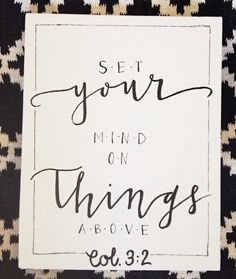 a black and white photo with the words set your mind on things above it in cursive font