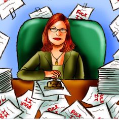 a woman sitting at a desk surrounded by papers