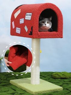 a cat is peeking out of a red mailbox that has been decorated with stickers and magnets