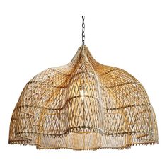 a large bamboo light fixture hanging from a chain