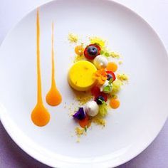 a white plate topped with different types of fruits and veggies on top of it