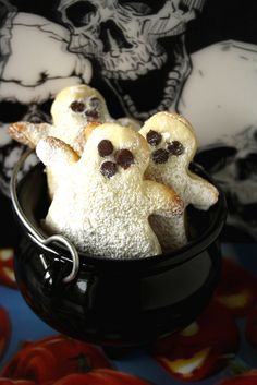 some cookies are in a black bowl on a table