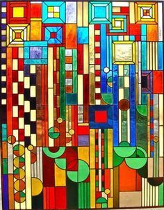 a colorful stained glass window with geometric shapes and lines on it's sides, as well as an abstract design