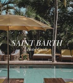 an outdoor pool with chairs and umbrellas next to the swimming pool at saint barth hotel