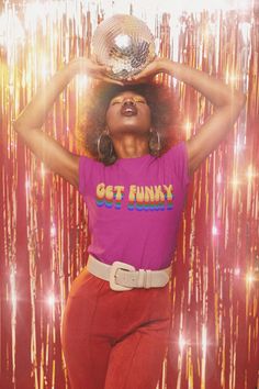 "Get ready to boogie with our \"Get Funky\" retro disco and funk-inspired t-shirt. That's right, this shirt was inspired by the funky and flashy fashion of the 70's Disco and Funk era.  The shirt features a bold rainbow text graphic of the words \"Get Funky\" and makes you feel like you just stepped out of a classic Disco or Funk song by the Bee Gees or Kool & The Gang. Made with soft and comfortable material, it's perfect for showing off your love for the vintage and funky vibes of the 70s on any occasion. Get your hands on this groovy design and be the life of the party! .: Retail fit .: Tear away label .: Runs true to size" Detroit Techno, Patti Hansen, 70s T Shirts, 70s Party, Get Funky, Lauren Hutton, Disco Era, 70s Disco, Dancing Queen