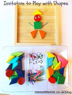 an open box filled with different colored shapes and materials to make a paper frog craft